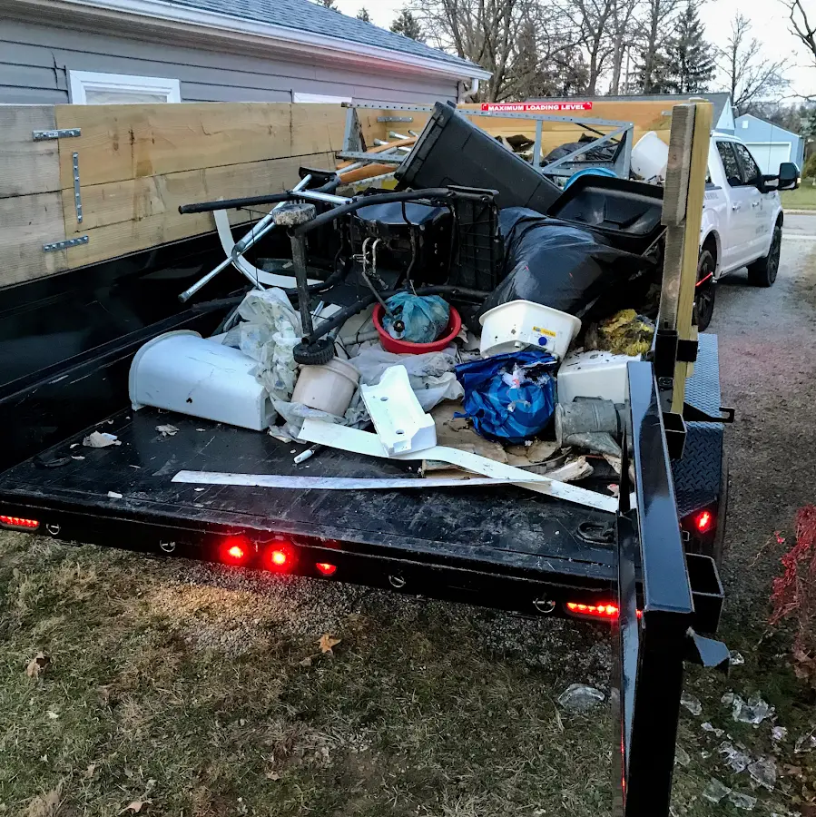 Roll-off dumpster delivered to a residential driveway in Lyons