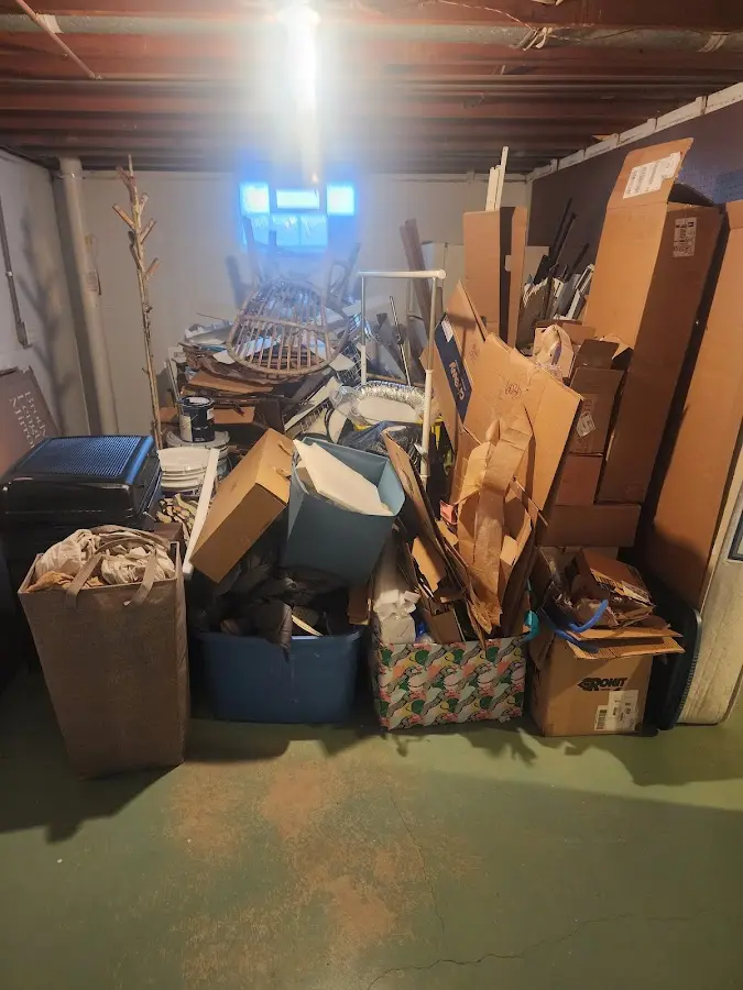 Roll-off dumpster container at job site for 15 Yard Dumpster Rental in Lyons