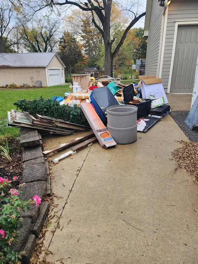 Dumpster being loaded with debris for 3 Yard Dumpster Rental in Lyons